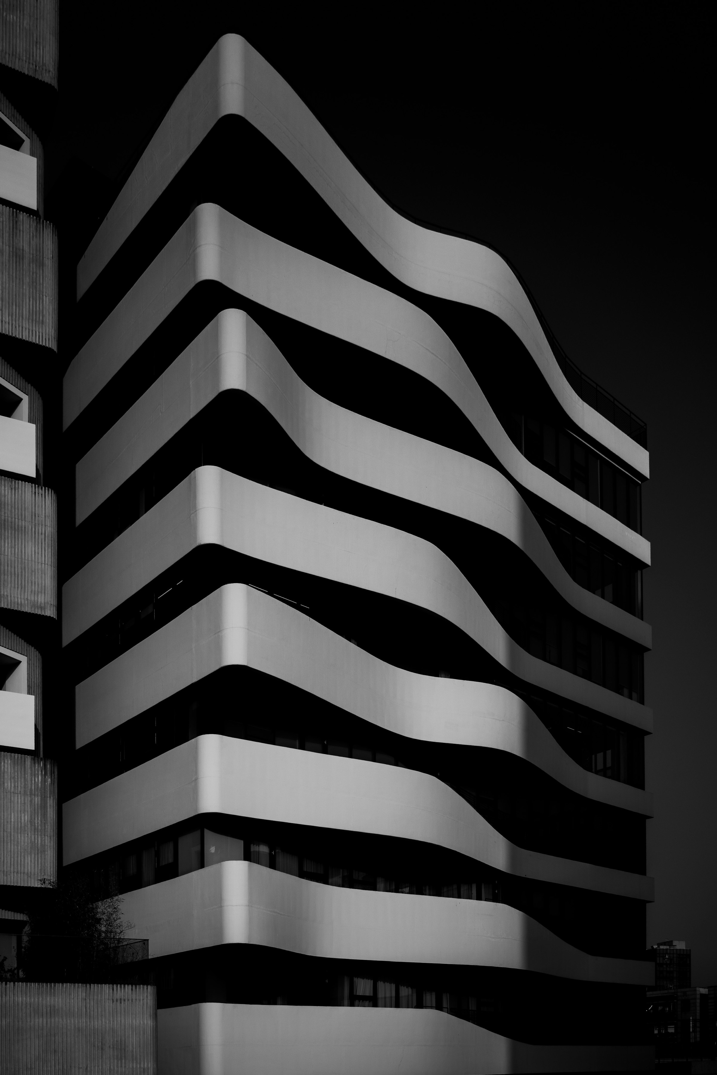 Sculptural concrete architecture with precise, sweeping lines